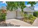 View of the driveway and two-car garage, showcasing the home's exterior features at 3865 Gatewood Dr, Sarasota, FL 34232