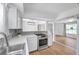 Charming kitchen featuring stainless steel appliances, tile backsplash, and an open concept layout at 3865 Gatewood Dr, Sarasota, FL 34232