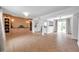 Open-concept living area with wood floors and modern fixtures at 3865 Gatewood Dr, Sarasota, FL 34232