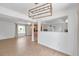 Bright open-concept living room featuring wood-look flooring and abundant natural light at 3865 Gatewood Dr, Sarasota, FL 34232