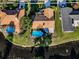 Aerial view of the backyard, pool and tranquil waterfront at 395 Forest Park Rd, Oldsmar, FL 34677