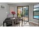 A sunny dining area with a view of the screened-in pool area at 395 Forest Park Rd, Oldsmar, FL 34677