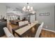 Open dining room view showcasing access to living room and natural light at 395 Forest Park Rd, Oldsmar, FL 34677