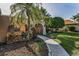 Welcoming front yard with lush landscaping, including palm trees and stone accents at 395 Forest Park Rd, Oldsmar, FL 34677