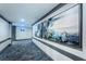 Well-lit hallway adorned with modern artwork and elegant gray trim, leading to the Heron's restaurant at 395 Forest Park Rd, Oldsmar, FL 34677