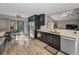 Bright kitchen showcases stainless steel appliances, and an adjacent breakfast nook with backyard views at 395 Forest Park Rd, Oldsmar, FL 34677