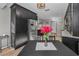 Kitchen with stainless steel fridge and dining table in view of the living room at 395 Forest Park Rd, Oldsmar, FL 34677