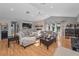 Spacious living room with a fireplace, wood floors, and plenty of natural light at 395 Forest Park Rd, Oldsmar, FL 34677