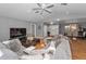 Open floor plan with spacious living room leading to dining area and front entrance at 395 Forest Park Rd, Oldsmar, FL 34677