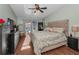 The bedroom is a calm space with an outdoor view and a neutral color scheme at 395 Forest Park Rd, Oldsmar, FL 34677