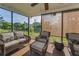 Inviting covered patio with comfortable seating and scenic views offers a serene outdoor oasis at 395 Forest Park Rd, Oldsmar, FL 34677