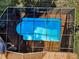 Aerial view of a screened pool featuring ladder entry, surrounded by mature landscaping at 395 Forest Park Rd, Oldsmar, FL 34677