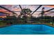 Enclosed pool with clear blue water, offering a private and serene outdoor space at 395 Forest Park Rd, Oldsmar, FL 34677