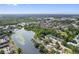Expansive aerial view of a residential area, bordered by lush greenery and waterways at 4013 Muriel Pl, Tampa, FL 33614