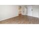 Bedroom with wood floors and a sliding barn door for closet access at 4013 Muriel Pl, Tampa, FL 33614