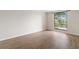 Bedroom featuring wood floors and a large window with a water view at 4013 Muriel Pl, Tampa, FL 33614
