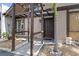 Inviting entryway featuring a modern pergola, elegant landscaping, and a freshly painted front door at 4013 Muriel Pl, Tampa, FL 33614
