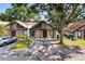 Inviting townhome featuring a well-maintained front yard and private driveway at 4013 Muriel Pl, Tampa, FL 33614