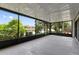 Spacious screened in porch offering serene views of the surrounding landscape at 4013 Muriel Pl, Tampa, FL 33614