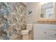 Cozy bathroom with patterned shower curtain, white vanity and granite countertop at 4204 Northwind Ln, Tampa, FL 33624