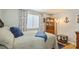 Bedroom featuring large window, side table and decor at 4204 Northwind Ln, Tampa, FL 33624