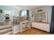 Bright dining area with chandelier, view of kitchen, and stylish furnishings at 4204 Northwind Ln, Tampa, FL 33624