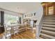 Dining room with natural light, table for 6-8, chandelier, and staircase to upstairs at 4204 Northwind Ln, Tampa, FL 33624