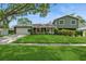 Charming two-story home with lush green lawn and well-maintained landscaping at 4204 Northwind Ln, Tampa, FL 33624