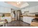 Bright kitchen features white cabinets, stainless steel appliances, and tile backsplash at 4204 Northwind Ln, Tampa, FL 33624