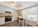 Bright eat-in kitchen with stainless steel appliances, white cabinetry, and ample natural light at 4204 Northwind Ln, Tampa, FL 33624