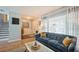 Cozy living room featuring a comfortable sofa, modern decor, and plenty of natural light at 4204 Northwind Ln, Tampa, FL 33624