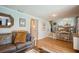 Bright living room with view to dining area, wooden floors and comfortable sofa at 4204 Northwind Ln, Tampa, FL 33624