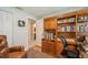 Bright home office space with wood floors, built in shelving, and space for a chair and desk at 4204 Northwind Ln, Tampa, FL 33624