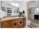 Bathroom features an updated vanity with granite countertop and a tiled glass shower at 4220 Woodlark Dr, Tampa, FL 33624