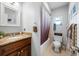 Bathroom features a stylish vanity and a shower with a curtain at 4220 Woodlark Dr, Tampa, FL 33624