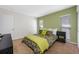 Bright bedroom with neutral colors, green accent wall, and comfortable looking bed at 4220 Woodlark Dr, Tampa, FL 33624
