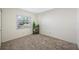 Serene bedroom with a window view and neutral carpet at 4220 Woodlark Dr, Tampa, FL 33624