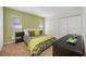 Bedroom featuring neutral tones, carpet flooring, a comfortable bed, and ample closet space at 4220 Woodlark Dr, Tampa, FL 33624
