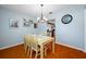 The dining room boasts hardwood floors, natural light, and views into the kitchen, perfect for entertaining at 4220 Woodlark Dr, Tampa, FL 33624