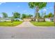 Inviting home with a two-car garage, a well-kept lawn, and established landscaping, offering great curb appeal at 4220 Woodlark Dr, Tampa, FL 33624