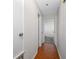 Well-lit hallway with hardwood floors connects to various rooms at 4220 Woodlark Dr, Tampa, FL 33624