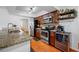 Gourmet kitchen featuring granite countertops, stainless steel appliances, and wood cabinetry at 4220 Woodlark Dr, Tampa, FL 33624
