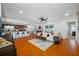 Bright living room with wood floors connects to kitchen, dining room and a backyard at 4220 Woodlark Dr, Tampa, FL 33624