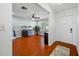 Inviting living room boasts wood floors, ceiling fan, and a calming color scheme for relaxation at 4220 Woodlark Dr, Tampa, FL 33624