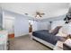 Comfortable main bedroom with ceiling fan, barn door to bathroom and large closets at 4220 Woodlark Dr, Tampa, FL 33624