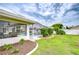 Inviting backyard space featuring a covered patio with easy access to a screened-in pool and backyard area at 4368 Las Palmas Ave, Spring Hill, FL 34606
