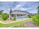 Lush landscaped backyard with a pristine screened pool, creating a perfect oasis for relaxation and entertainment at 4368 Las Palmas Ave, Spring Hill, FL 34606