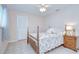 Bedroom featuring a ceiling fan, tile flooring, wood-frame bed, and neutral walls at 4368 Las Palmas Ave, Spring Hill, FL 34606