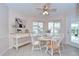 Cozy dining area with bright natural light, a ceiling fan, and seamless access to outdoor pool at 4368 Las Palmas Ave, Spring Hill, FL 34606