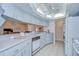 Well-lit kitchen featuring ample counter space and seamless flow into the living room at 4368 Las Palmas Ave, Spring Hill, FL 34606